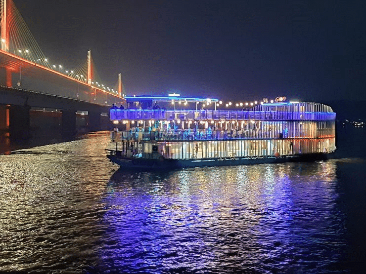A cruise in the middle of a sea with lights